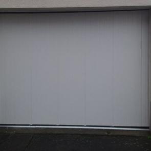 Porte de garage à refoulement latéral